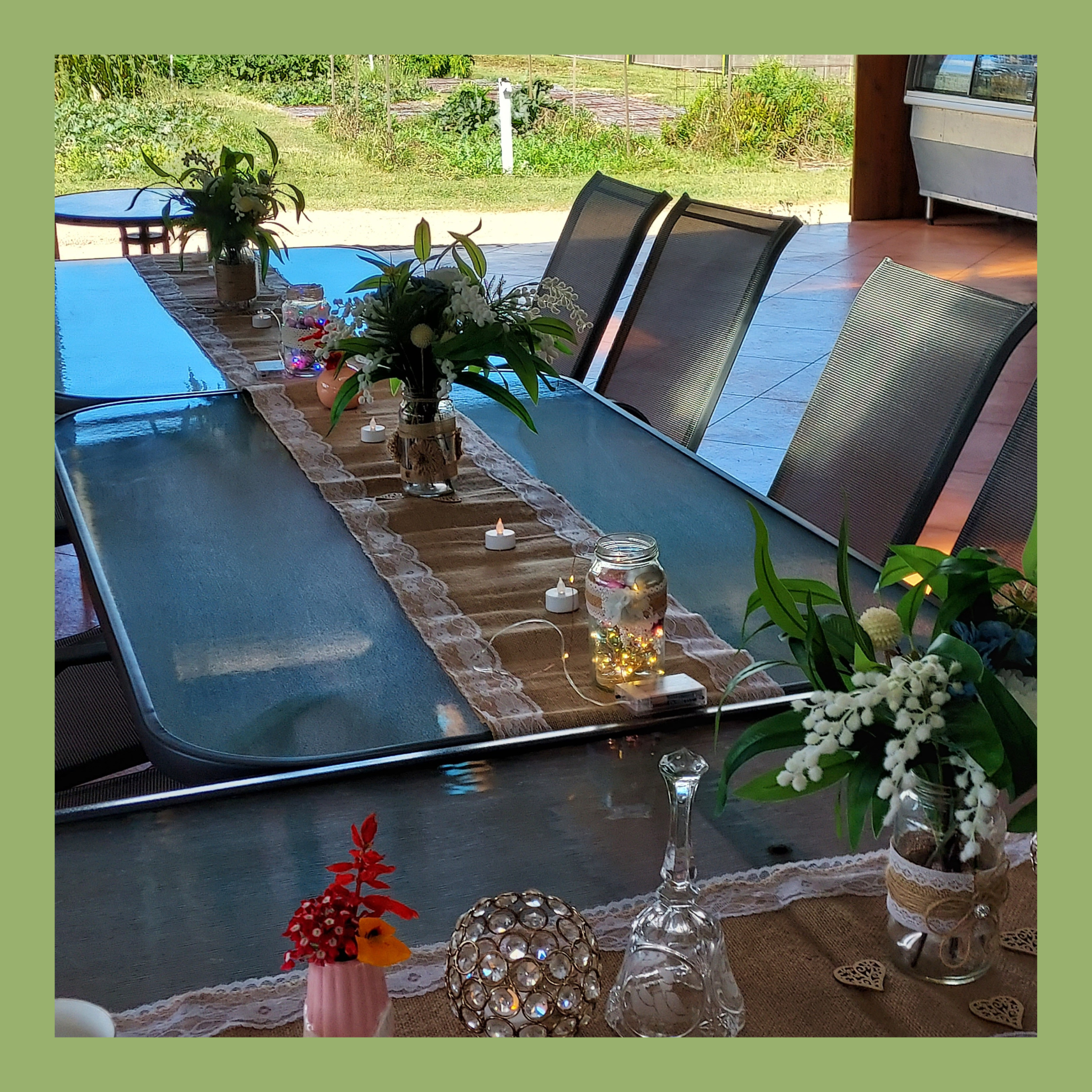 Rustic outdoor dining table setup with plants and decorations at Evergrow Farm, venue hire Inverell.