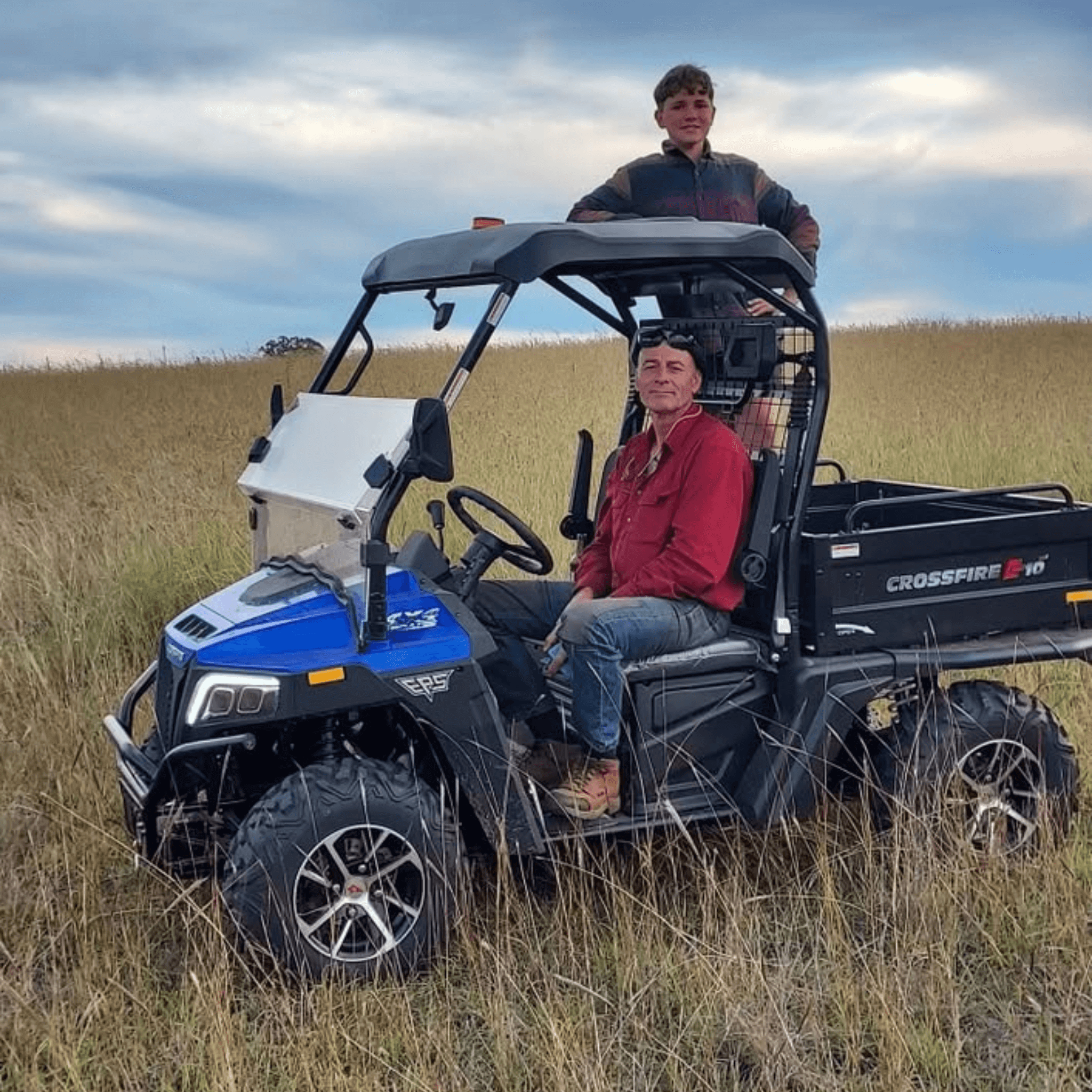 School holiday activities family farm experience with kids enjoying a farm tour on an ATV in open paddock